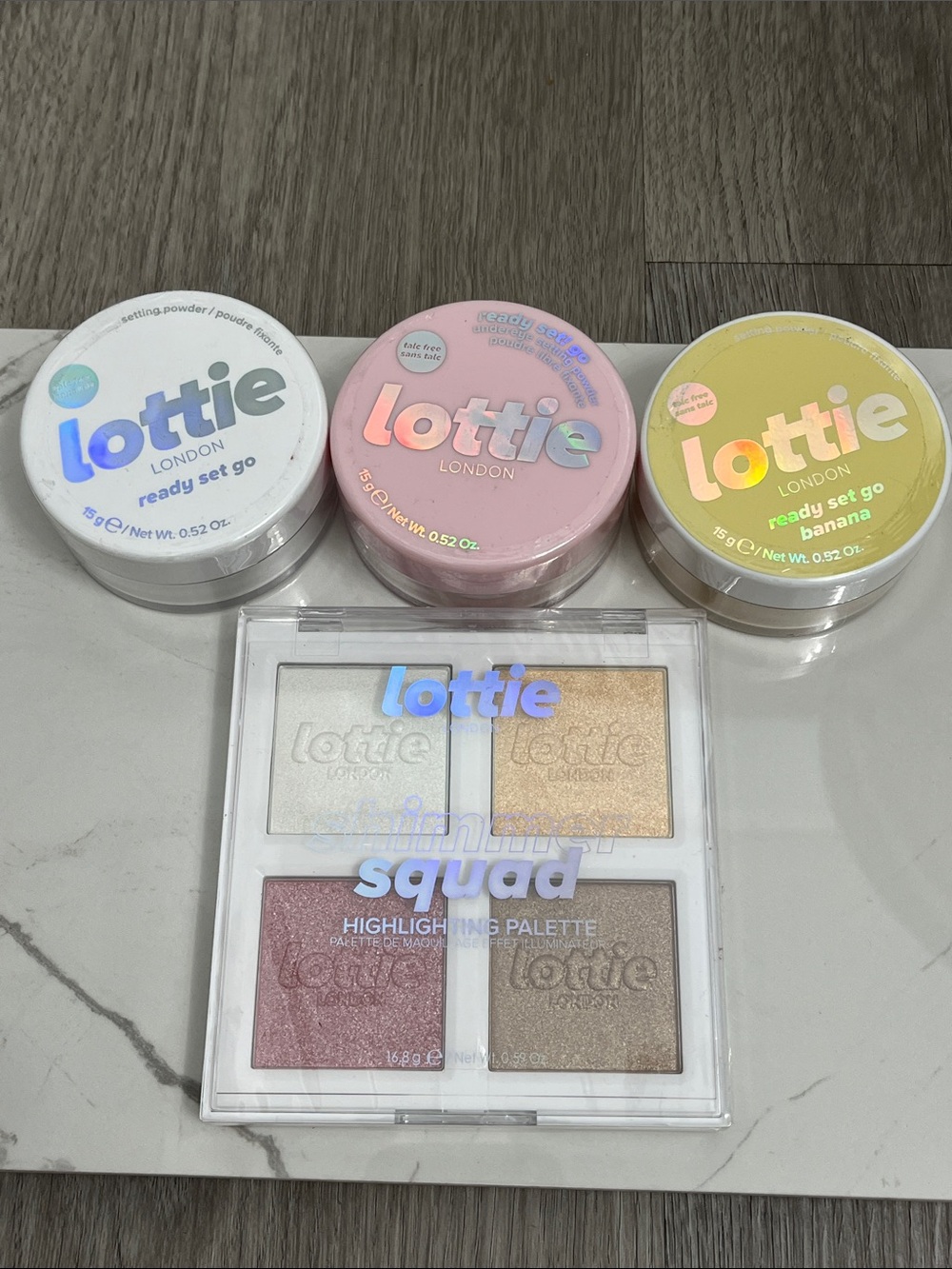 Lottie London shimmer squad highlighting palette and setting powder lot makeup